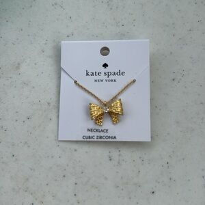 Kate Spade gold Wrapped in a Bow cubic zirconia necklace. NWT.